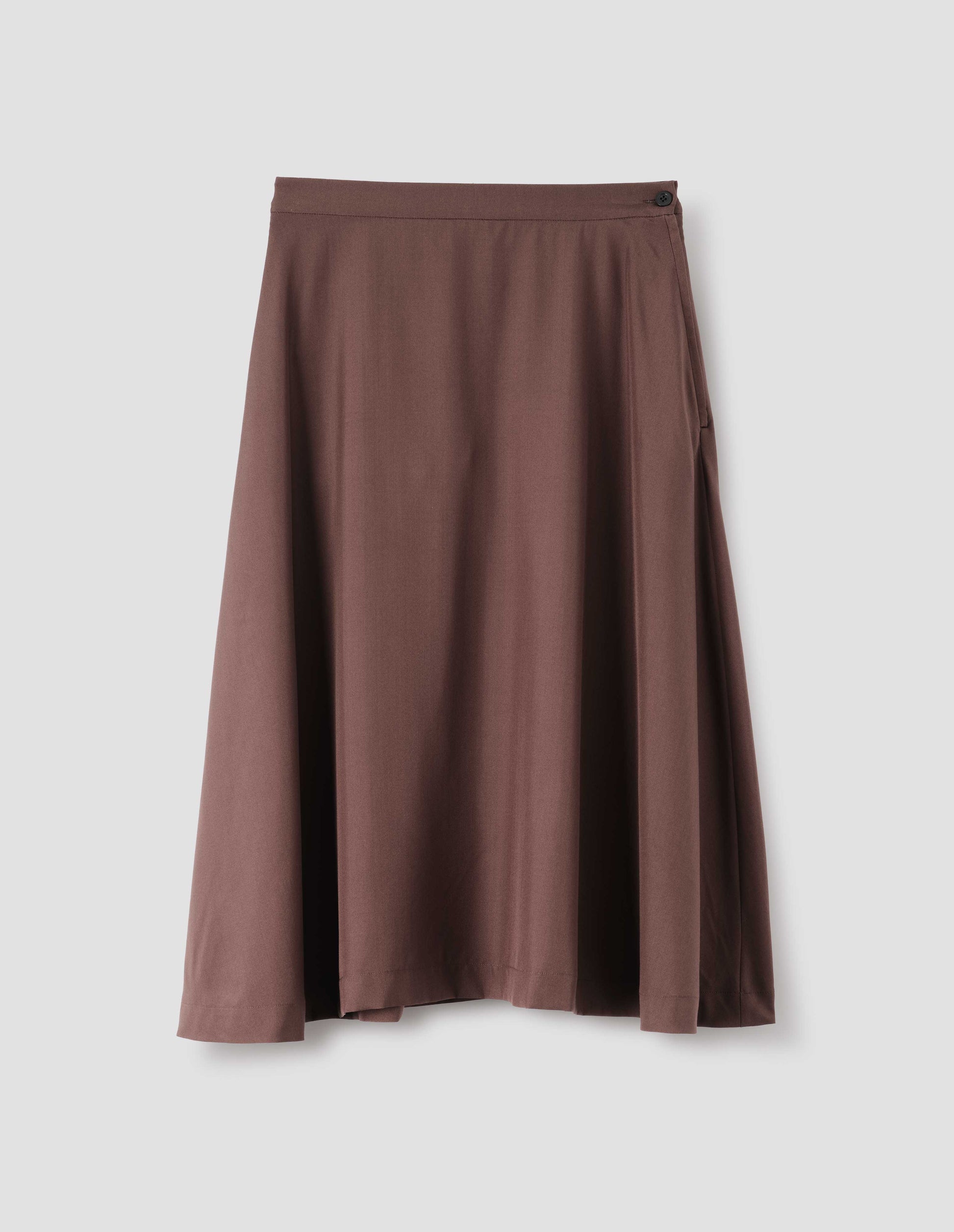 Brown matt silk skirt, with side closure and horn button detailing on the waist. Front flat lay view. 