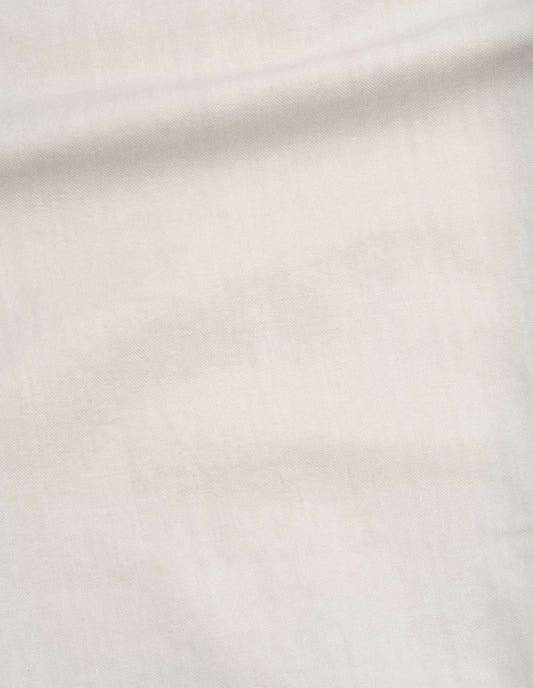 Beige irregular cotton drill button belt trousers, fabric swatch. 