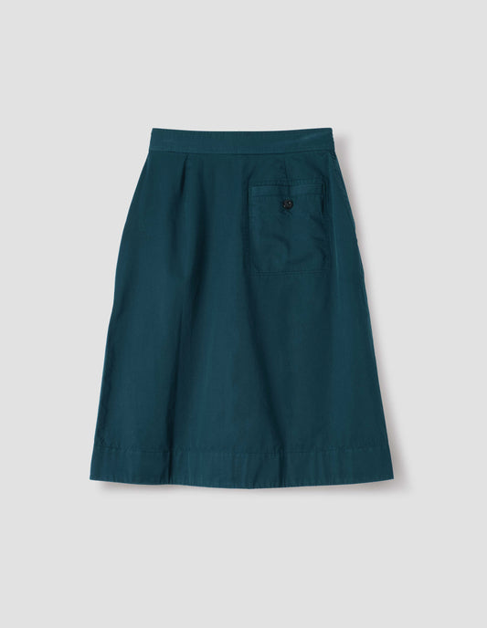 Greenish blue cotton twill skirt, with wide crossover waistband and stitch through welt back pocket. Back flat lay view.