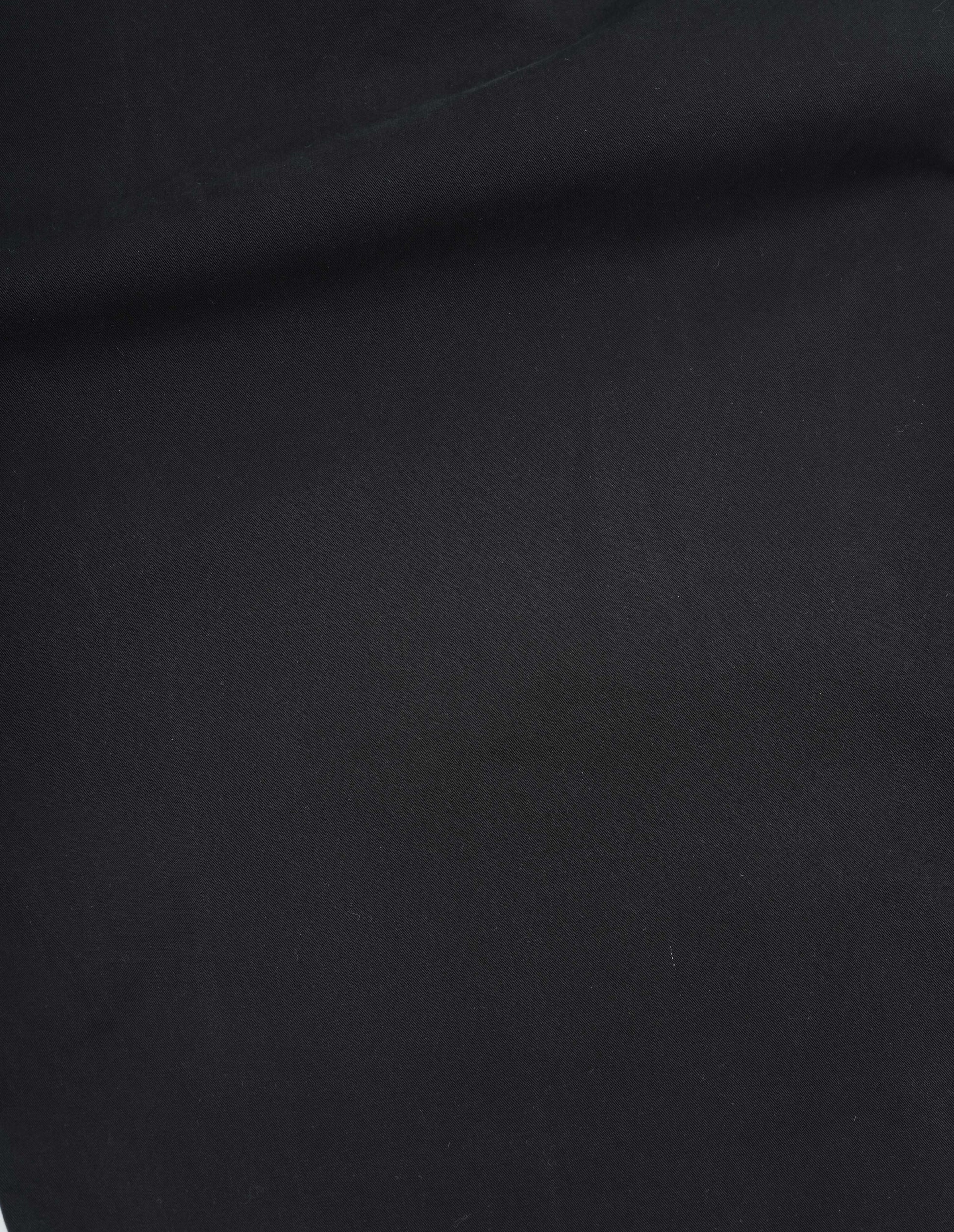 Black matte cotton twill skirt, fabric swatch.