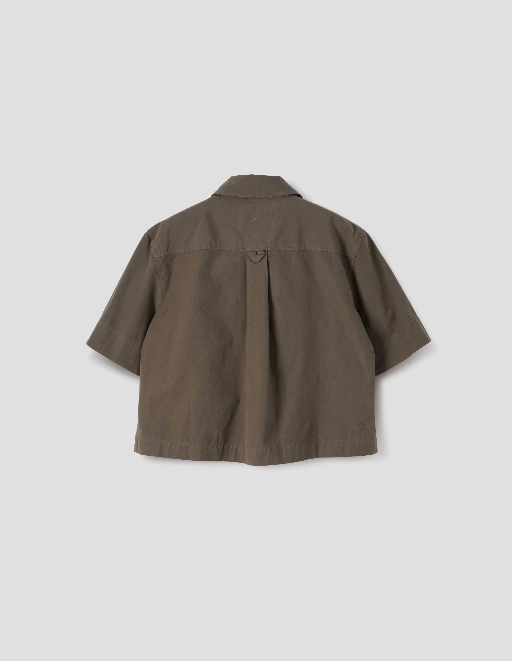 Greenish brown short sleeve cotton shirt, with box pleat on back yoke and hanger loop detailing. Back flat lay view. 