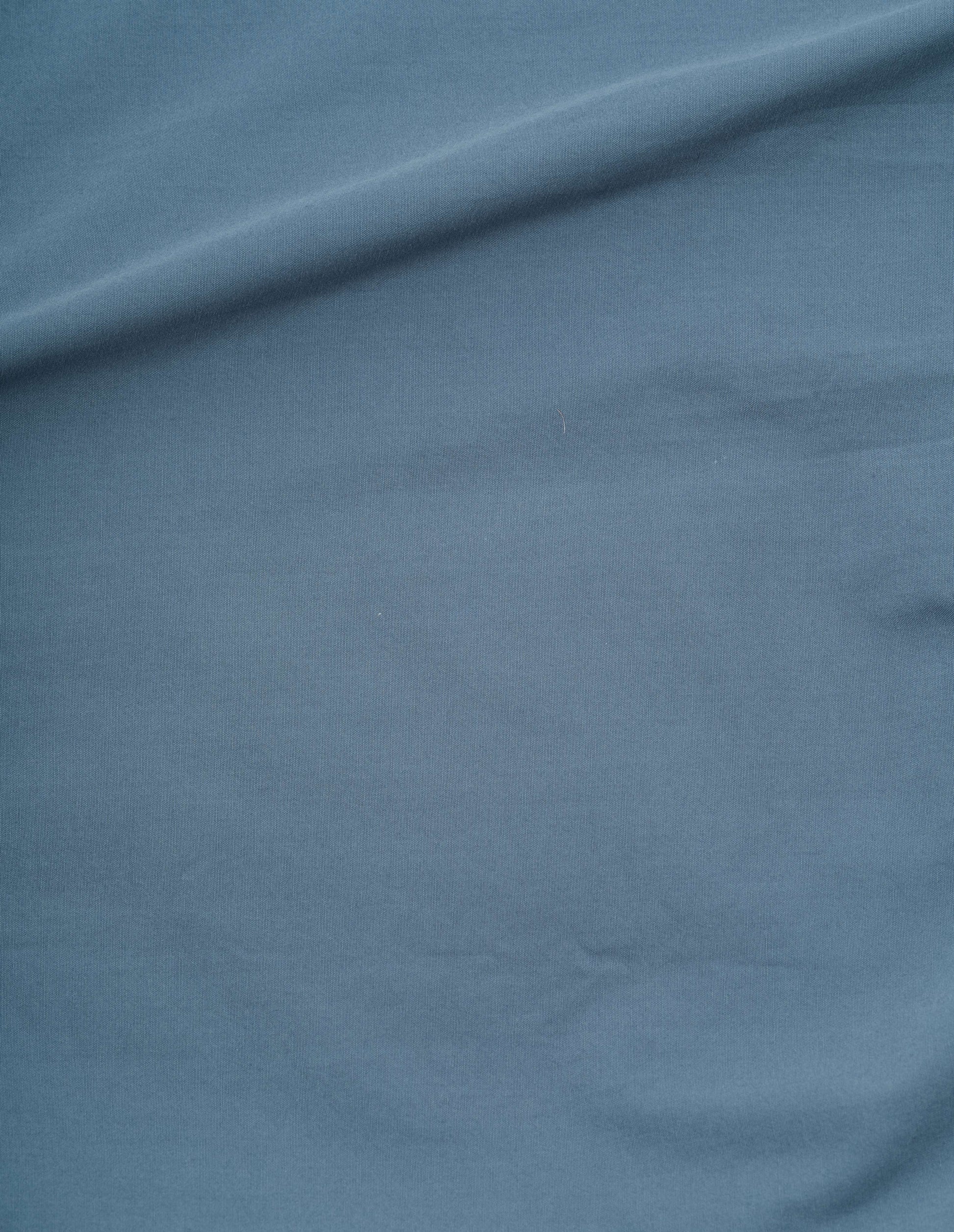 Blue short sleeve sanded cotton poplin shirt, fabric swatch.