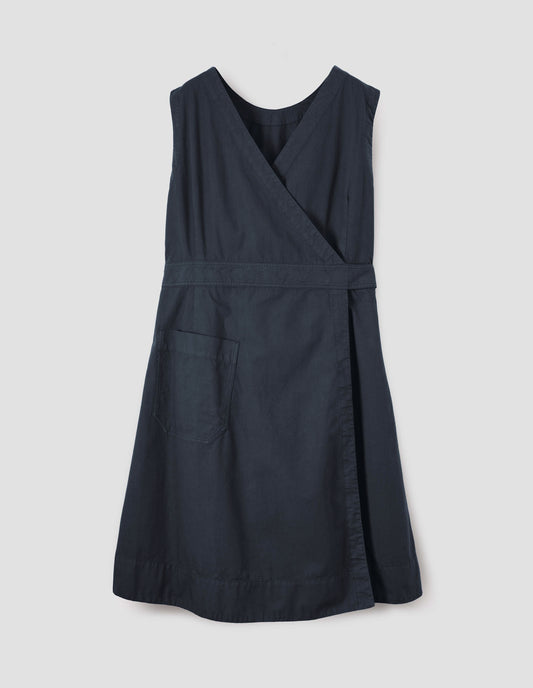 Dark navy cotton sleeveless dress with v detail on back, wrap around belt, back patch pocket and deep stitch hem. Back flat lay view.