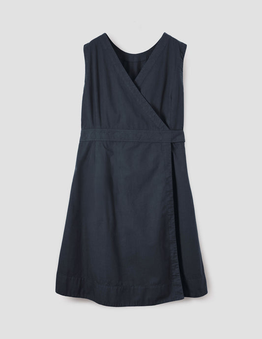 Dark navy cotton sleeveless dress with v detail on back, wrap around belt and deep stitch hem. Back flat lay view.