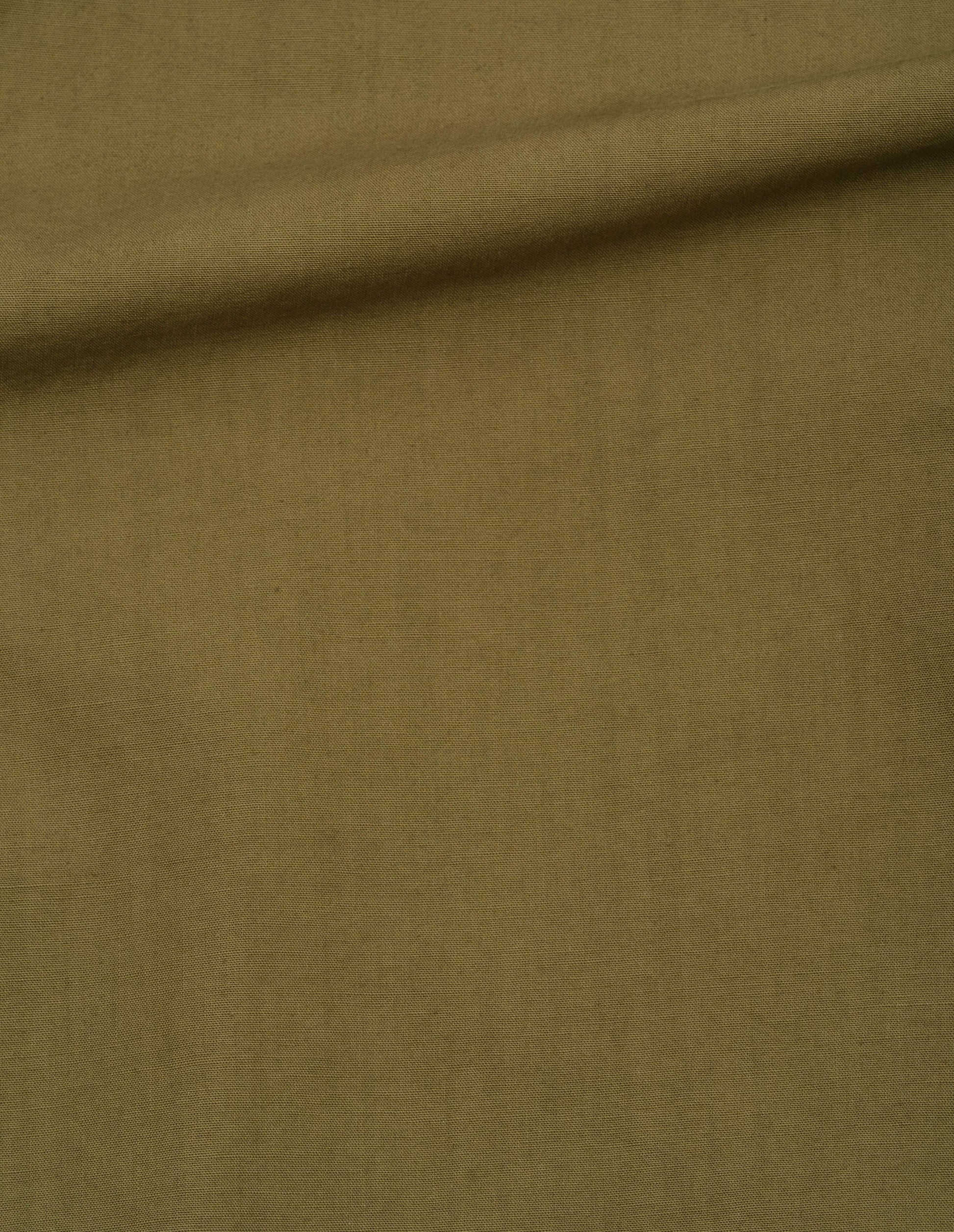 Green coarse yarn cotton sleeveless dress, fabric swatch.