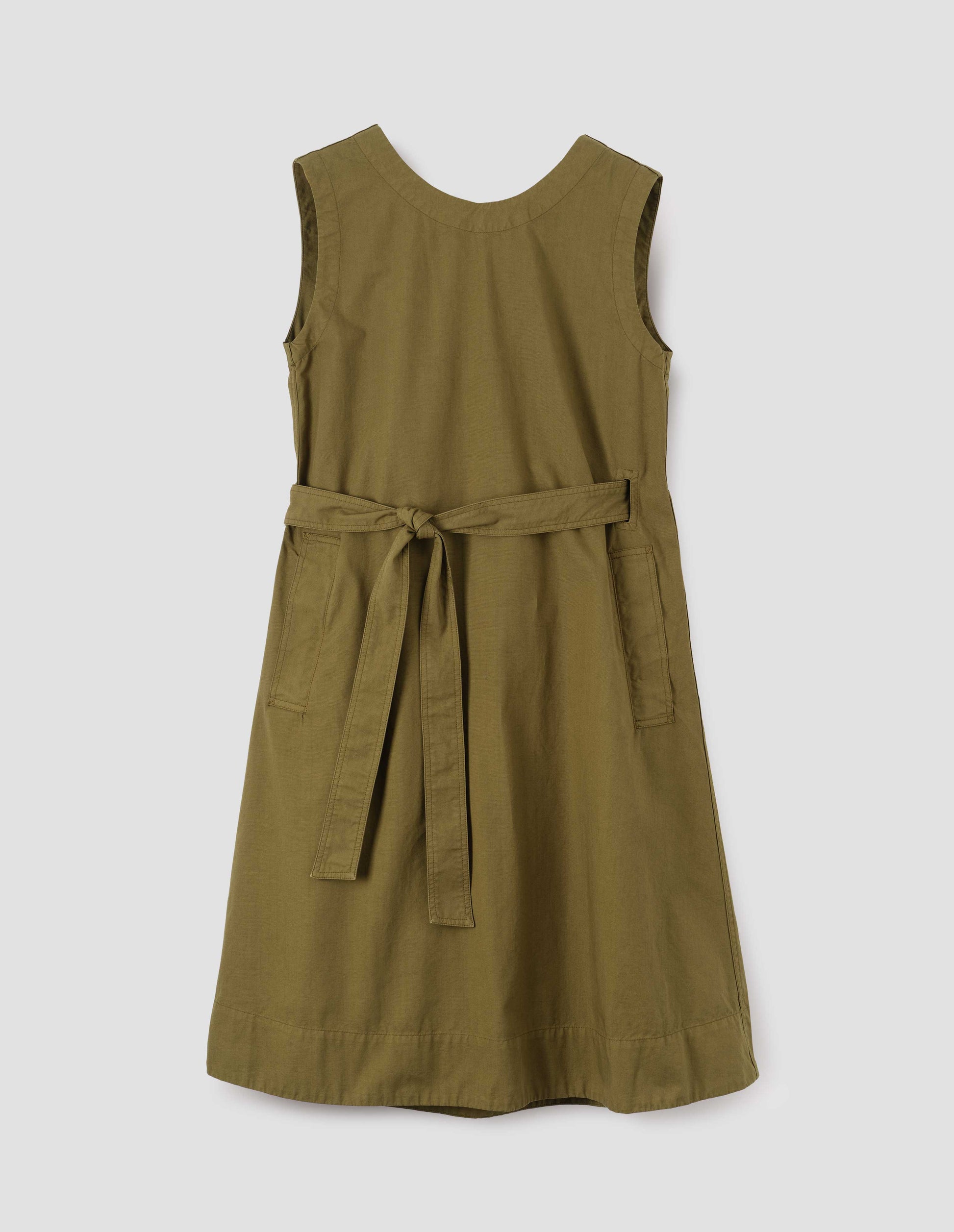 Green cotton sleeveless dress with round neck, wrap around belt, side seam pockets and deep stitch hem. Front flat lay view.