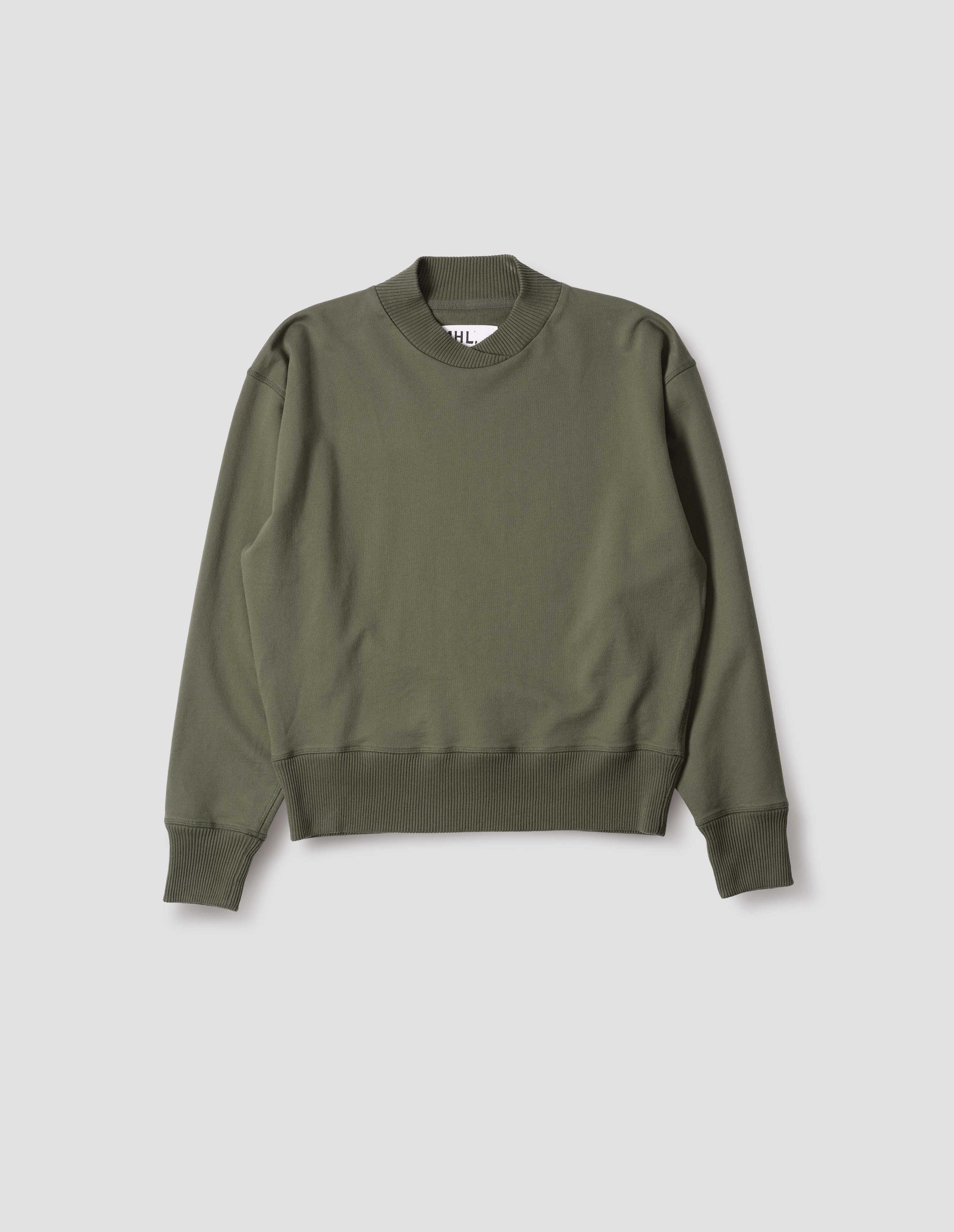 Green cotton sweatshirt, with soft rib neck with crossover detail and ribbed cuffs and hem. Front flat lay view.