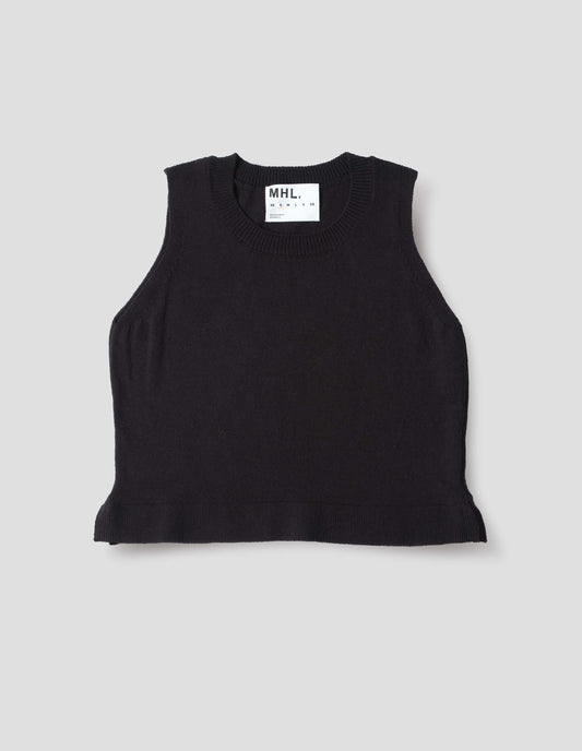 Black knitted tank top with single rib crew neck and side split rib hem. Front flat lay view.