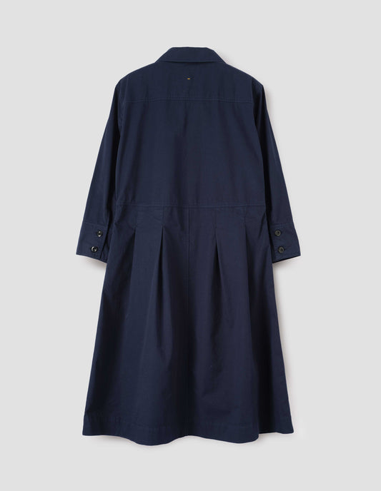 Dark blue cotton pleated shirt dress, with double corozo button fastening cuffs and pleats on seam from waist down. Back flat lay view. 