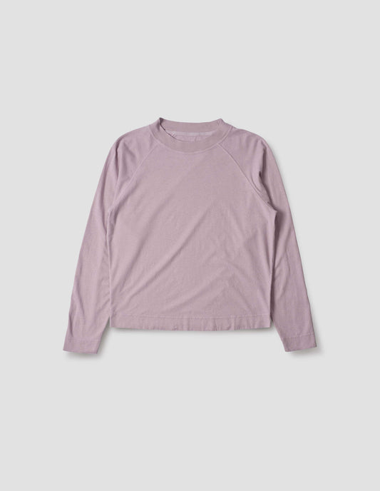 Lilac cotton linen long sleeve t-shirt with contrast rib on neckline and raglan sleeve detailing. Front flat lay view.