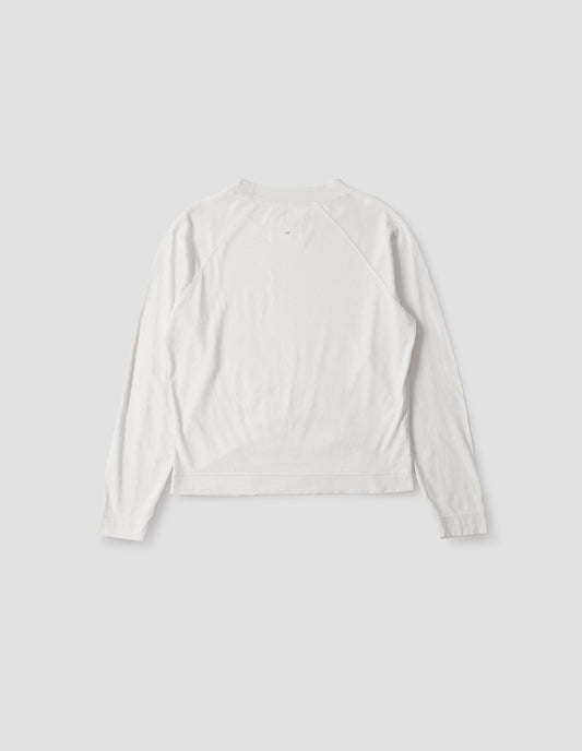 White cotton linen long sleeve t-shirt with contrast rib on neckline and raglan sleeve detailing. Back flat lay view.