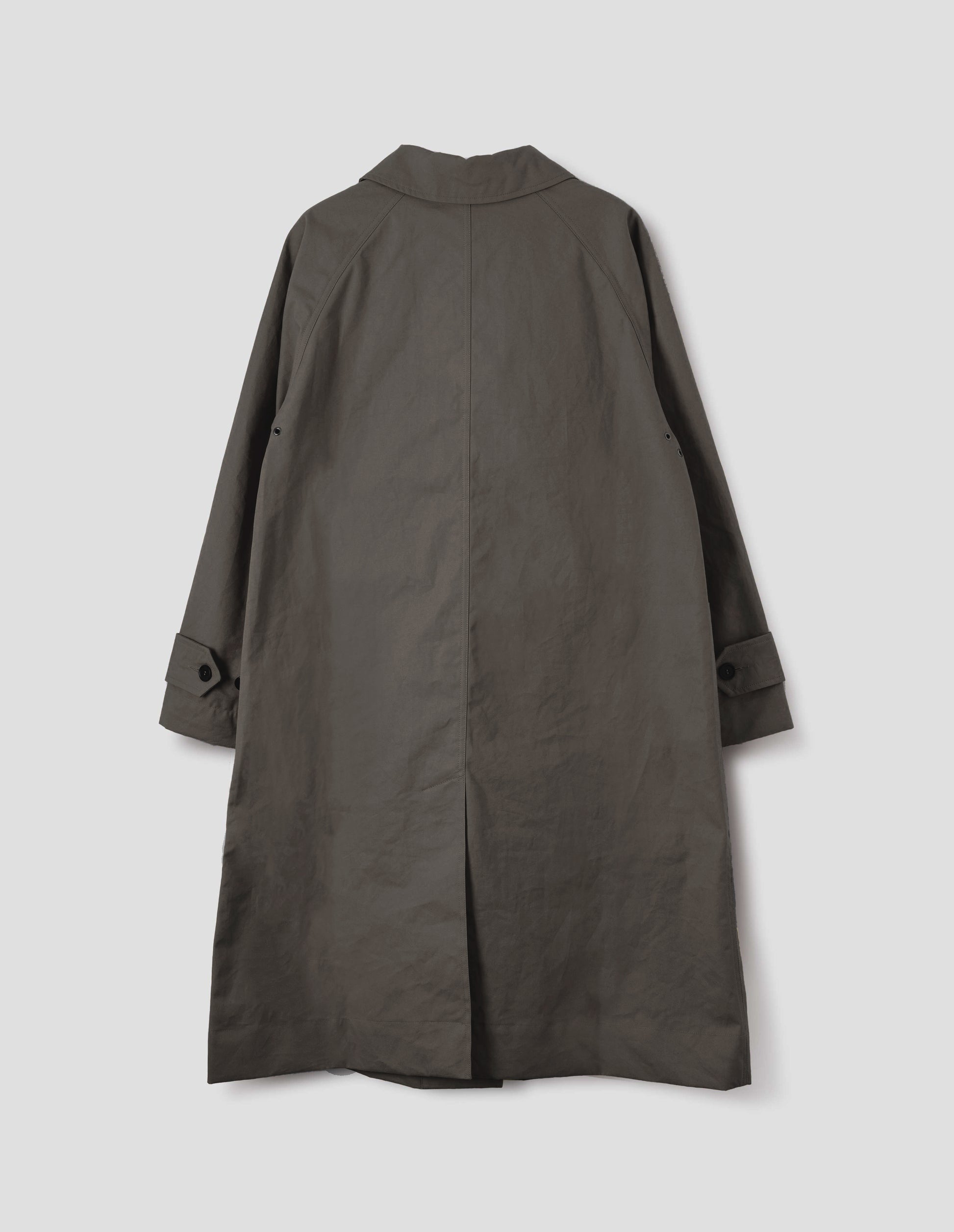 Greyish brown cotton canvas long sleeve mac, with button tab adjustable cuffs and rear vent. Back flat lay view.