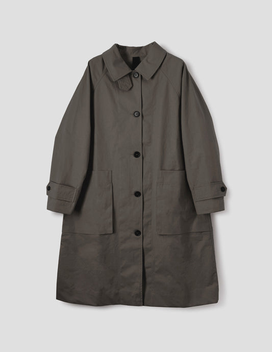 Greyish brown cotton canvas long sleeve mac, with storm tab fastening neck, raglan sleeve, button tab adjustable cuffs and large patch bellow pockets. Front flat lay view.
