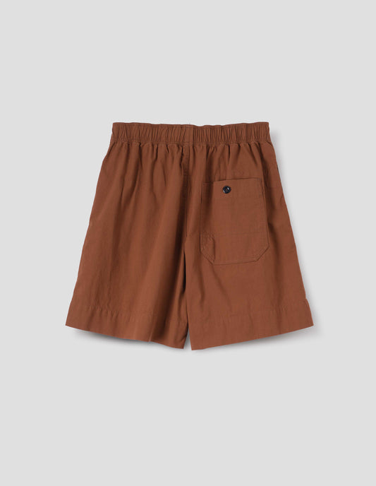 Dark orange shorts with elasticated waist and button-through patch pocket. Back flat lay view.