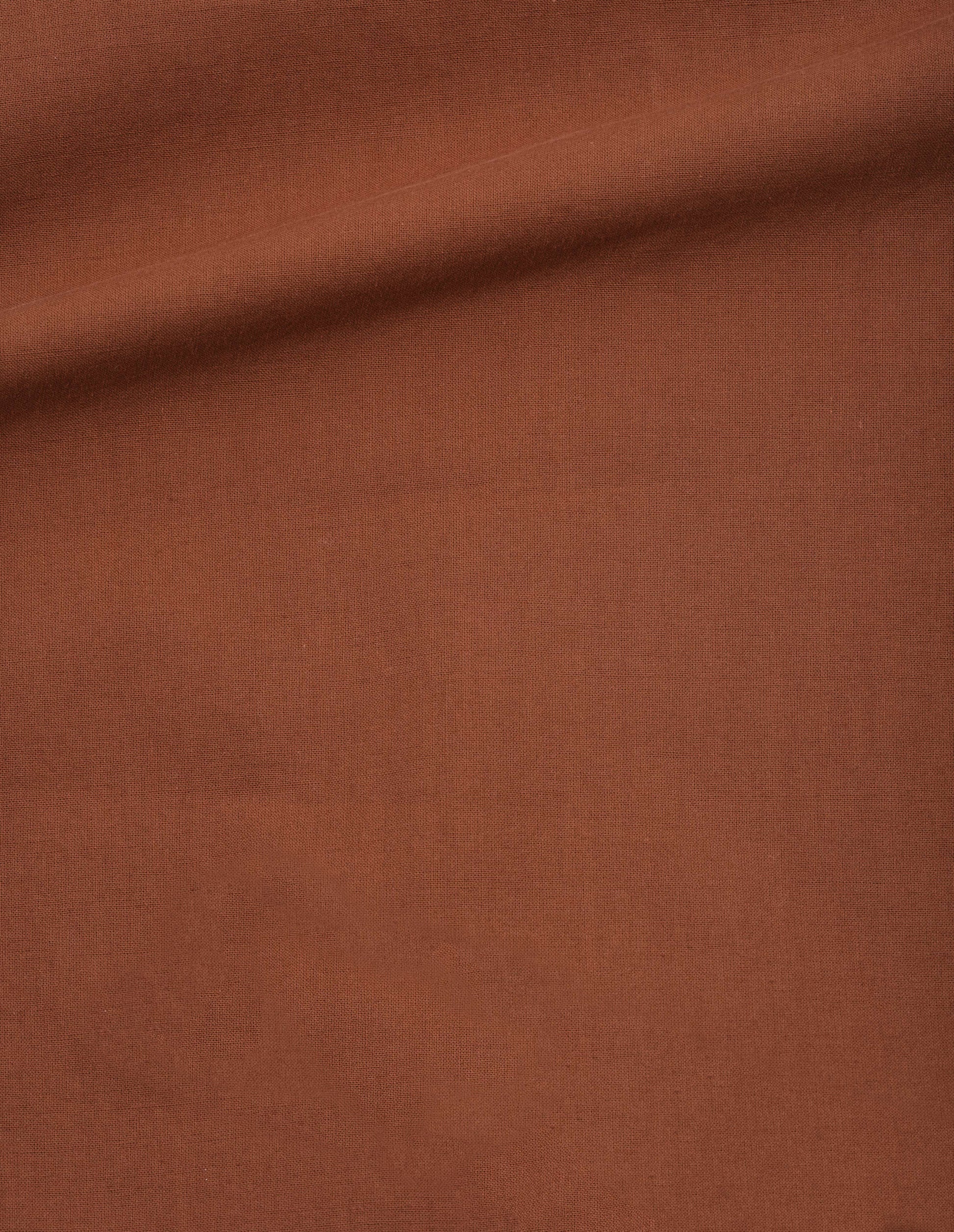 Dark orange light cotton plainweave shorts fabric swatch.