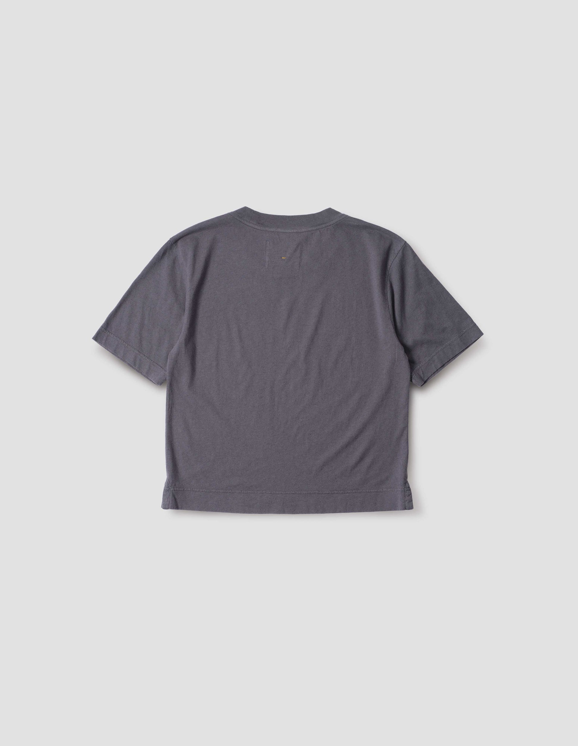 Greyish blue cotton and linen t-shirt, with vent split hem. Back flat lay view.