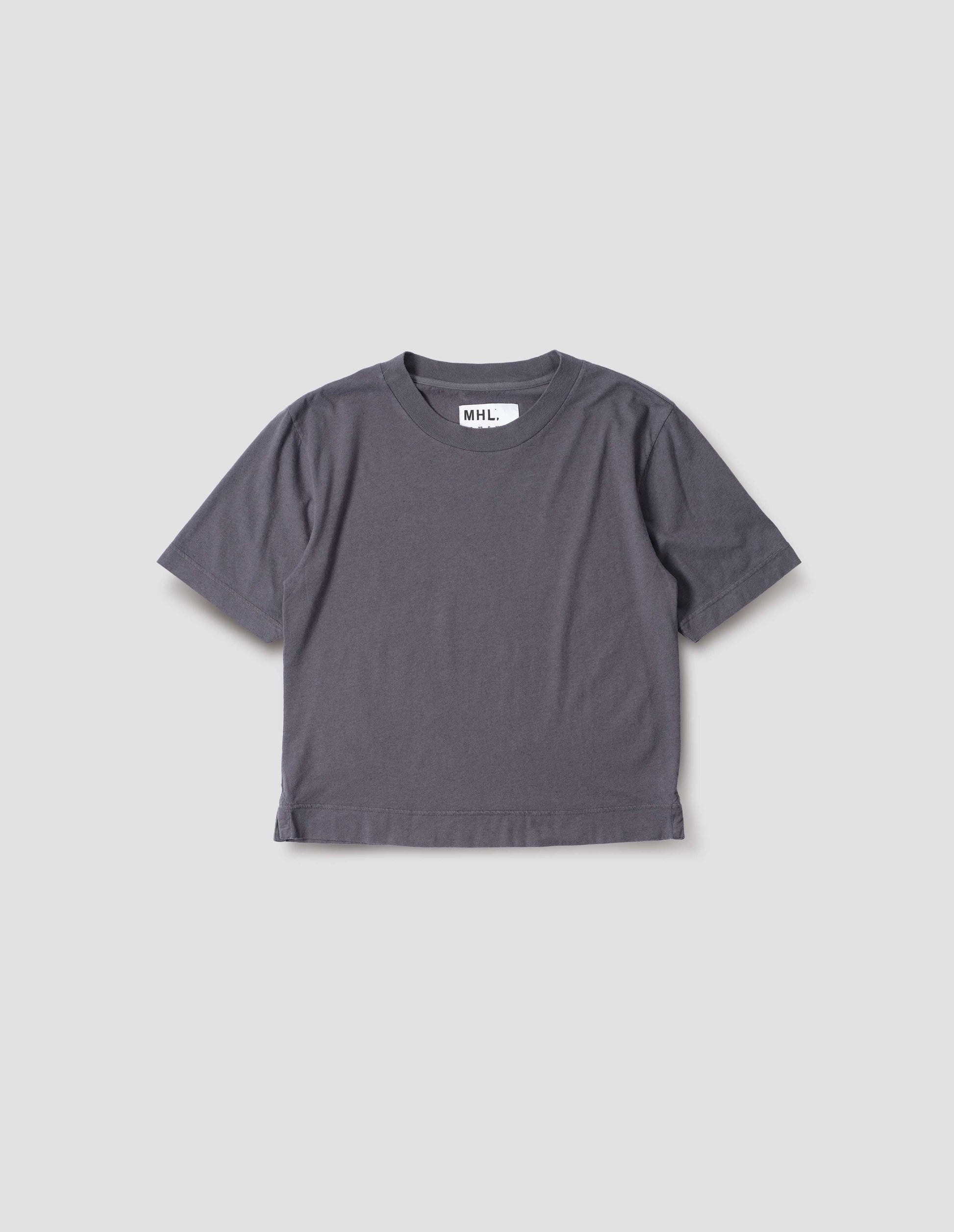 Greyish blue cotton and linen t-shirt, with herringbone tape detailing inside the neck and vent split hem. Front flat lay view.