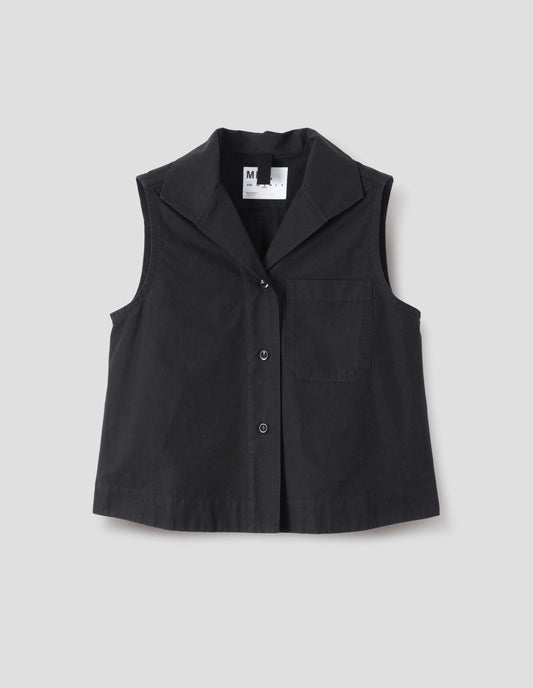 Black denim sleeveless shirt with one-piece open spread collar, wide stitch-through placket, corozo brace button closure and single chest pocket. Front flat lay view.