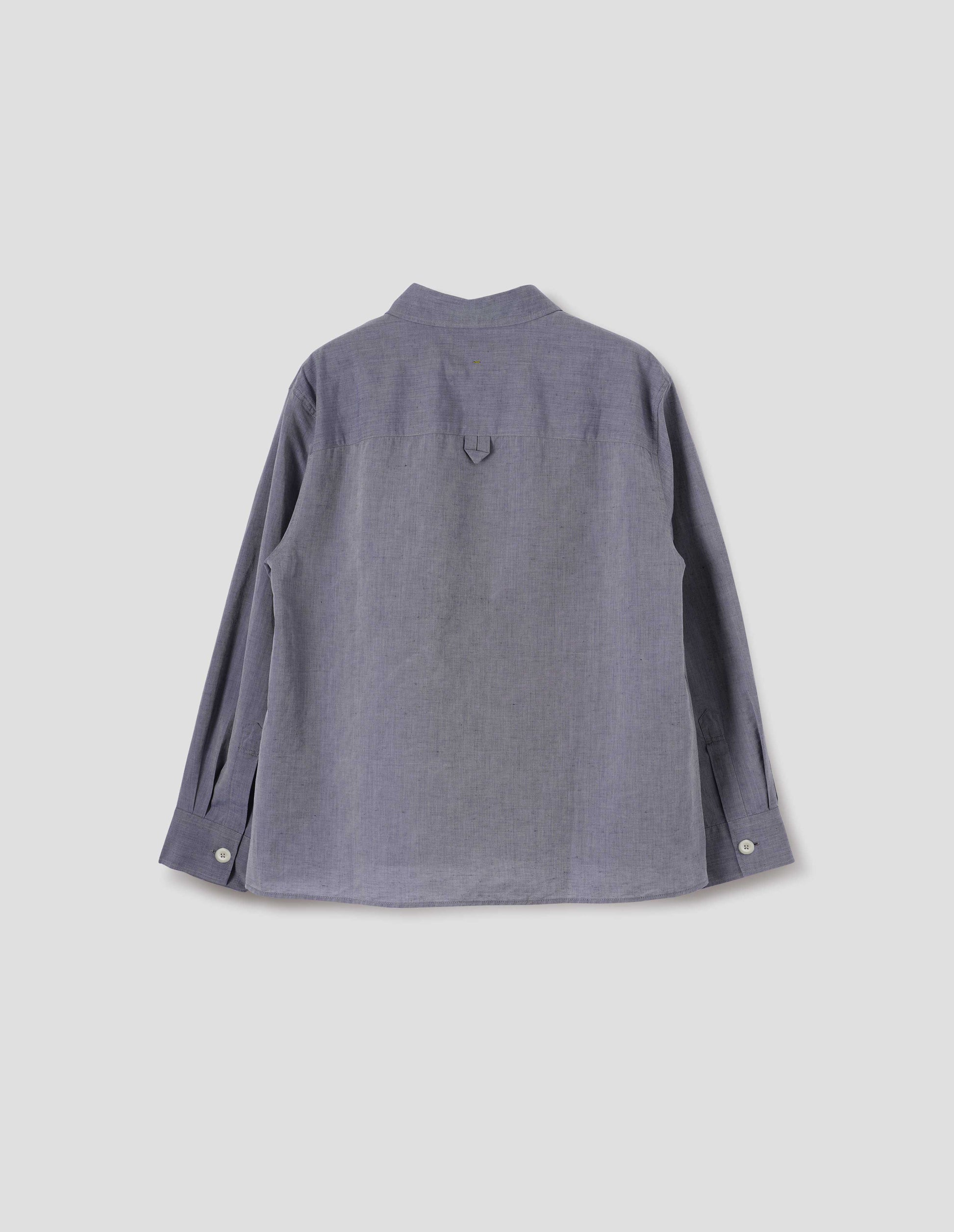 Greyish blue long sleeve cotton linen shirt, with side gusset stitching, hanger loop detail on back yoke and corozo brace button cuffs. Back flat lay view.