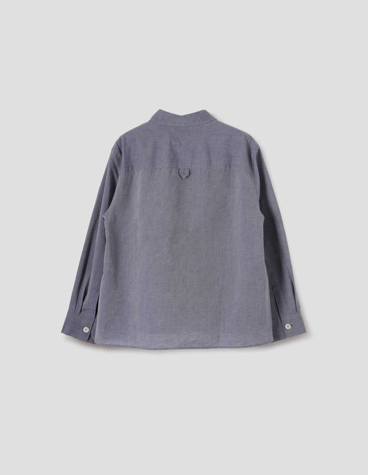 Greyish blue long sleeve cotton linen shirt, with side gusset stitching, hanger loop detail on back yoke and corozo brace button cuffs. Back flat lay view.