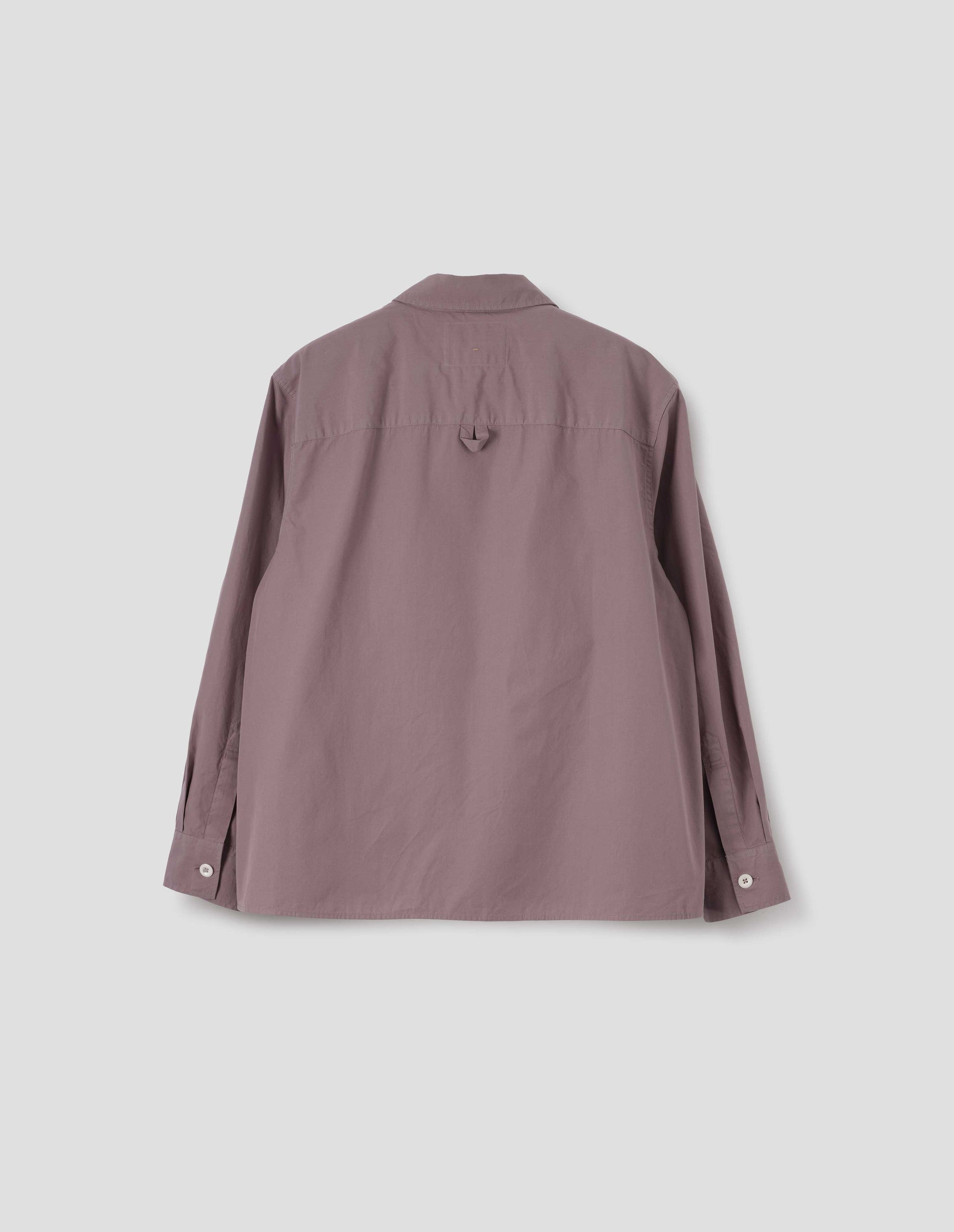 Purpleish pink cotton poplin swing shirt, with corozo button cuffs and contrast hanger loop detailing on back yoke. Back flat lay view. 
