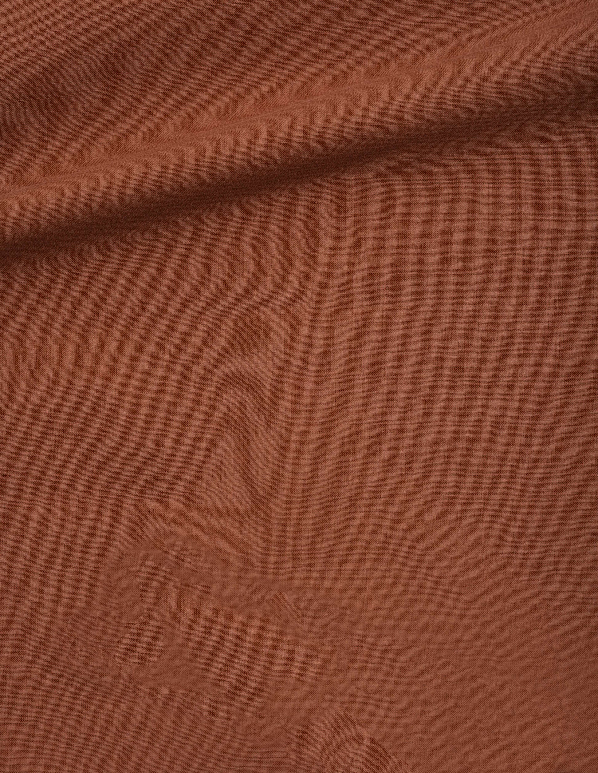Dark orange light cotton plainweave culottes fabric swatch.