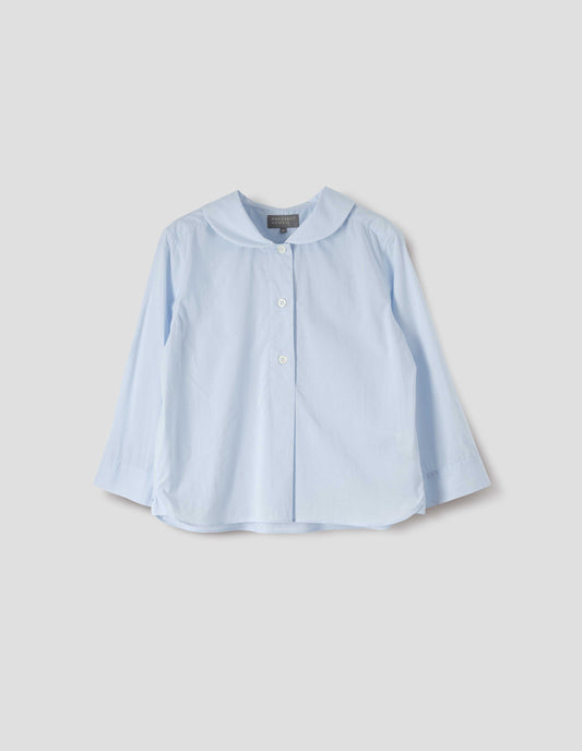 Light blue cotton shirt, with round petal collar, stitch through half placket, mother of pearl buttons and three quarter sleeves with turned back cuff detail. Front flat lay view.