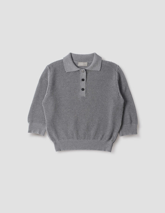 Dark grey cotton cashmere pointelle polo shirt, with solid seam detailing, rib collar, placket, cuffs and hem and horn button closure. Front flat lay view.