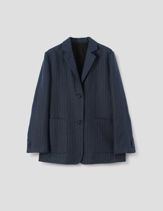 Dark navy blue and grey pinstripe linen blazer, with dropped shoulders, large patch pockets and horn button closure and cuffs. Front flat lay view.