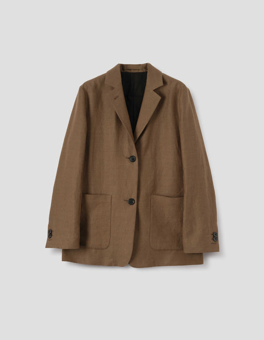 Brown blazer with dropped shoulders, large patch pockets and horn button closure and cuffs. Front flat lay view.