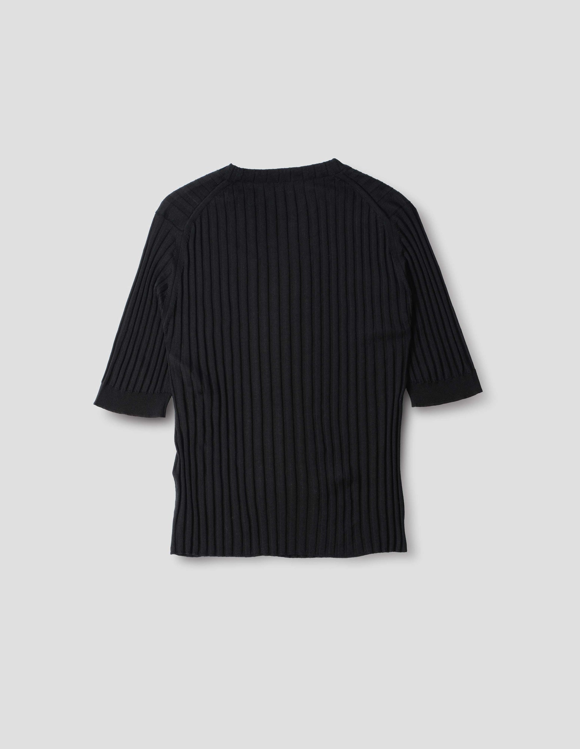 Black knitted ribbed t-shirt with round neck and fine rib sleeve cuffs. Back flat lay view.