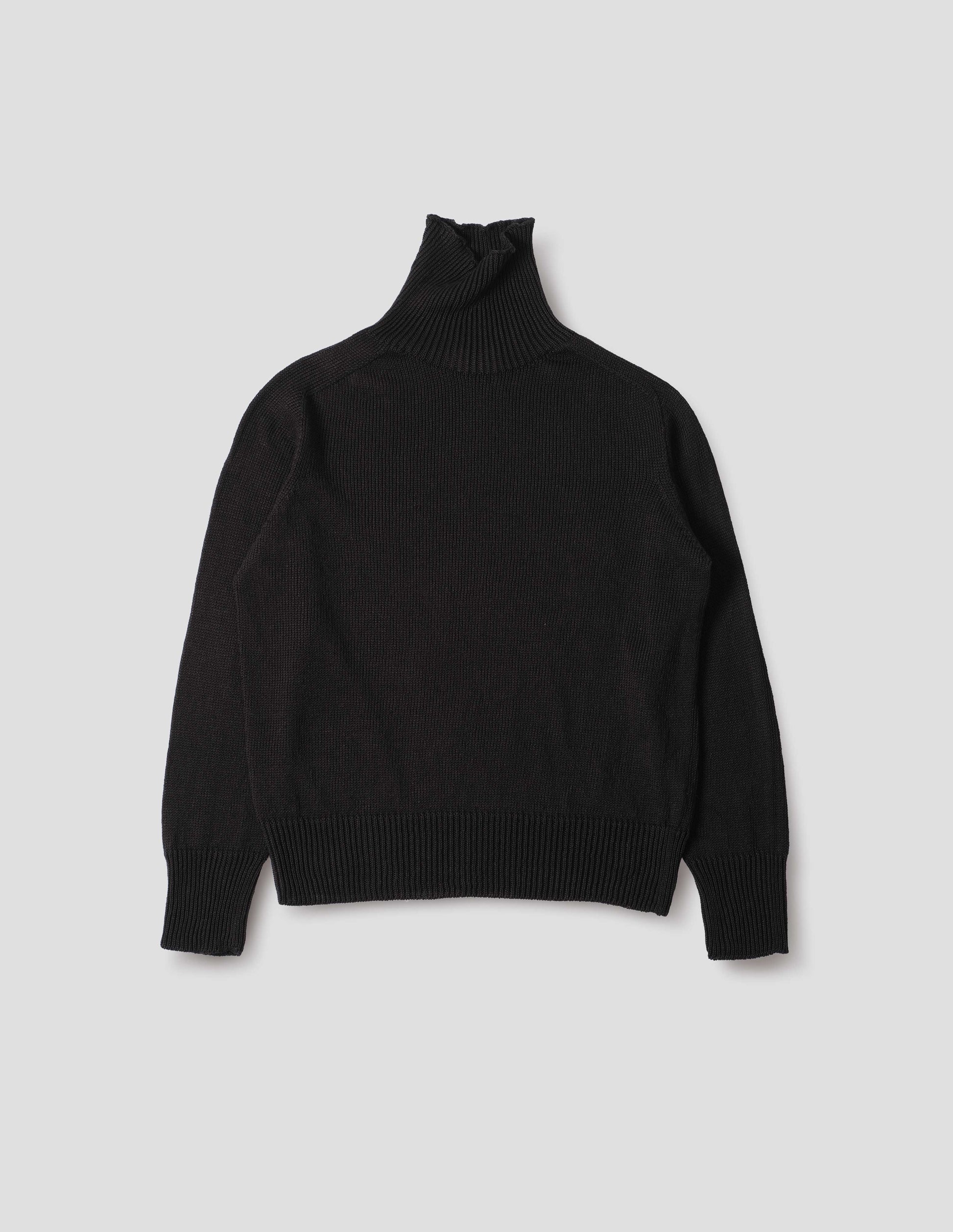 Black linen cotton roll neck jumper with long saddle sleeves and contrast rib on neck, cuffs and hem. Front flat lay view.