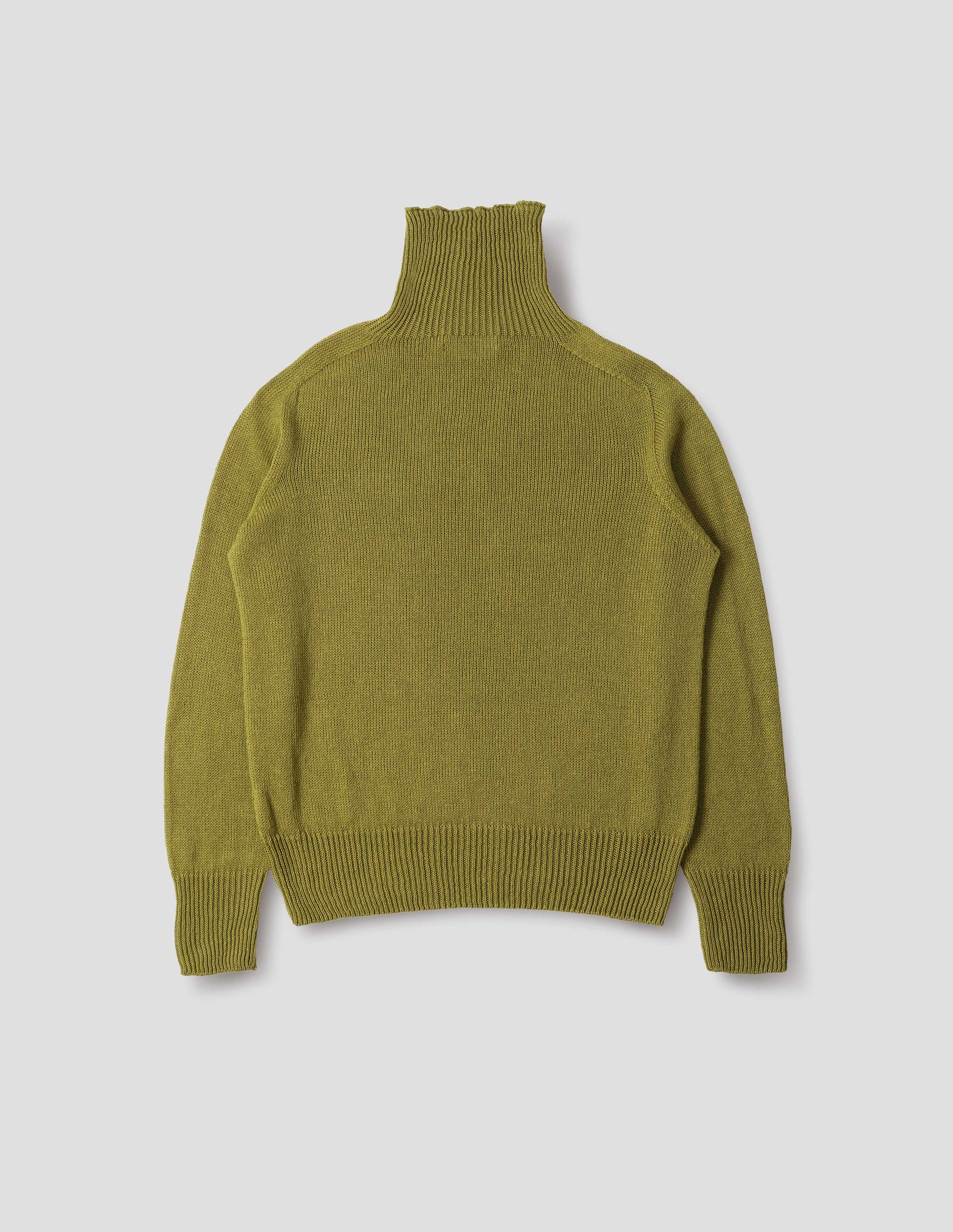 Yellowish green linen cotton roll neck jumper with long saddle sleeves and contrast rib on neck, cuffs and hem. Back flat lay view.
