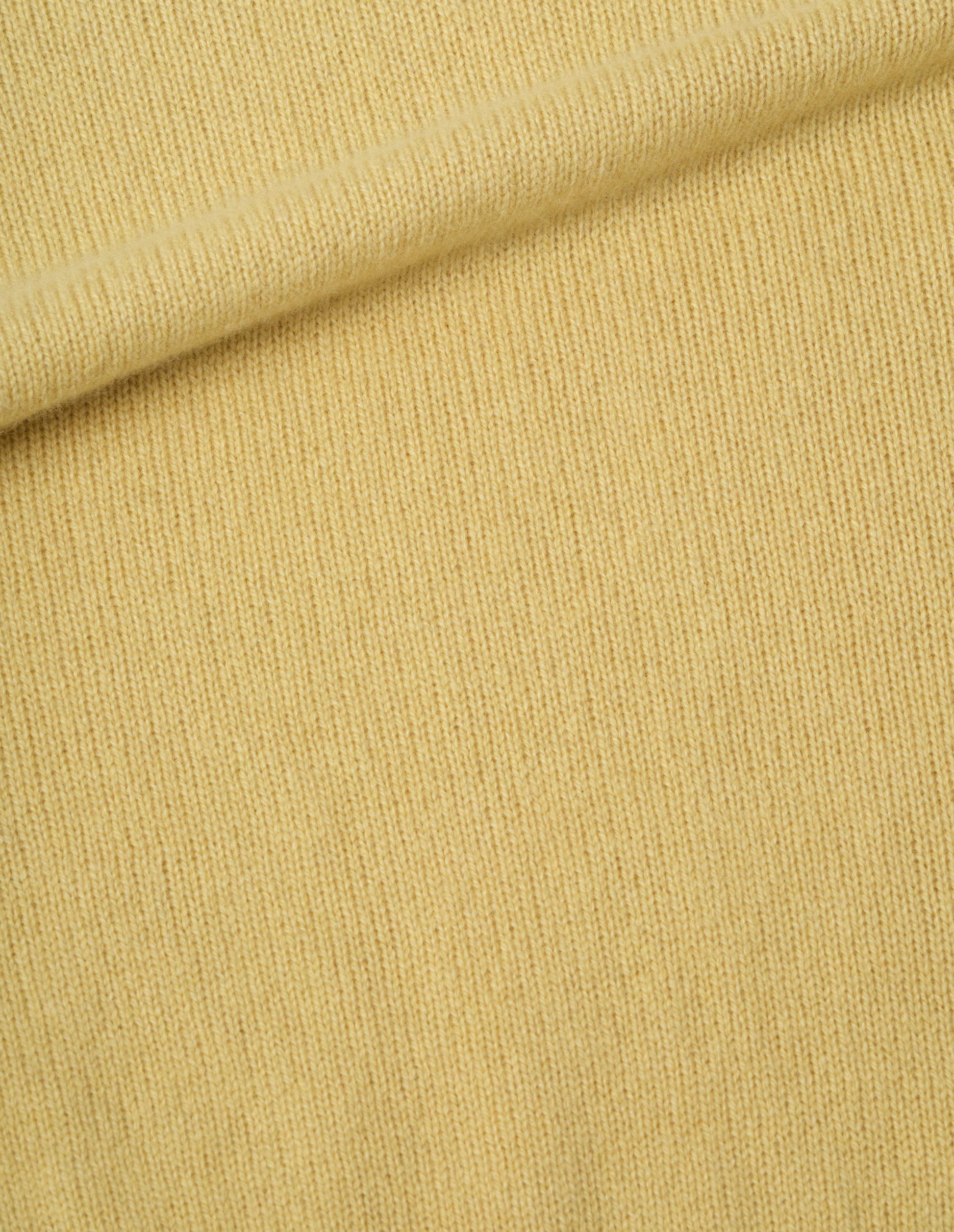 Yellow merino cashmere jumper, fabric swatch.