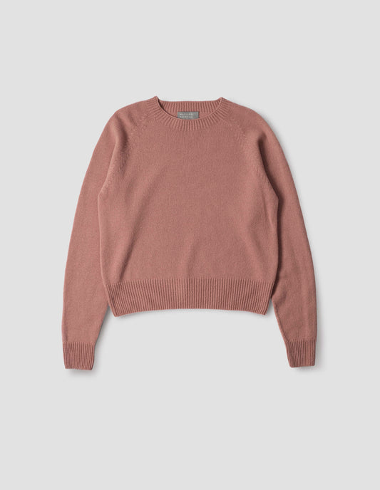 Pink long sleeve merino cashmere jumper, with raglan sleeve and contrasting rib on neck, cuffs and hem. Front flat lay view.