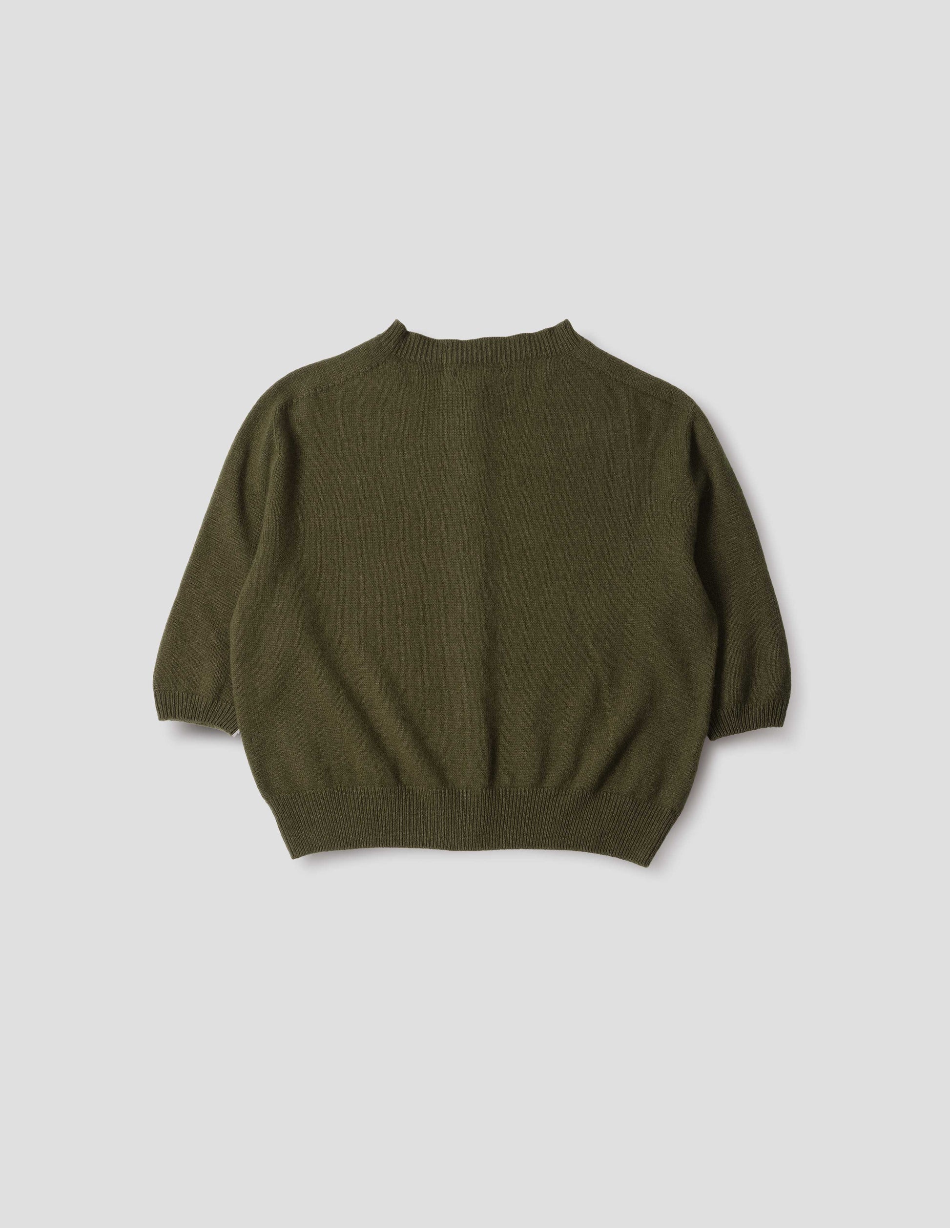 Dark green cashmere cotton cardigan, with elbow length saddle sleeve. Back flat lay view.