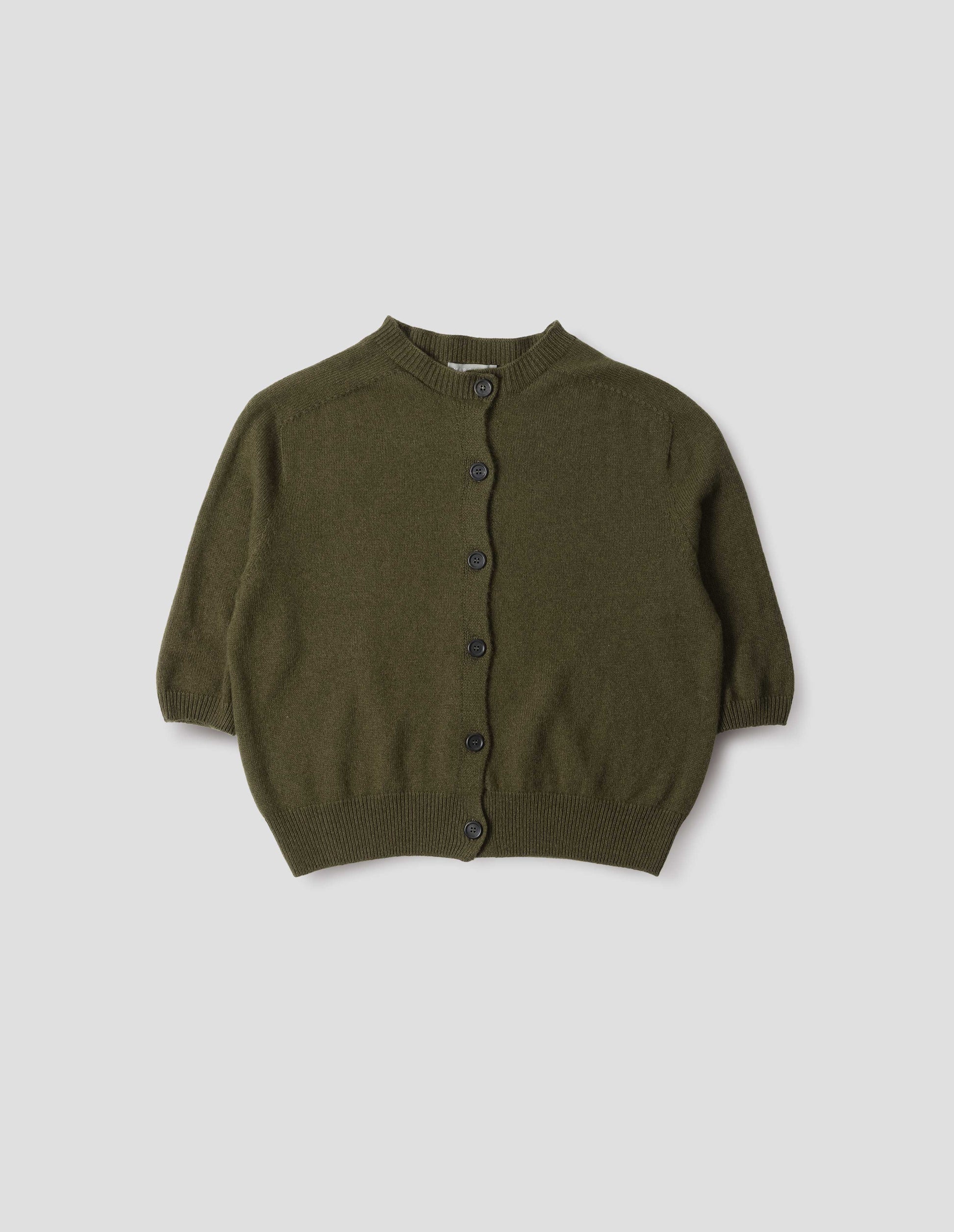 Dark green cashmere cotton cardigan, with elbow length saddle sleeve and large horn buttons. Front flat lay view.
