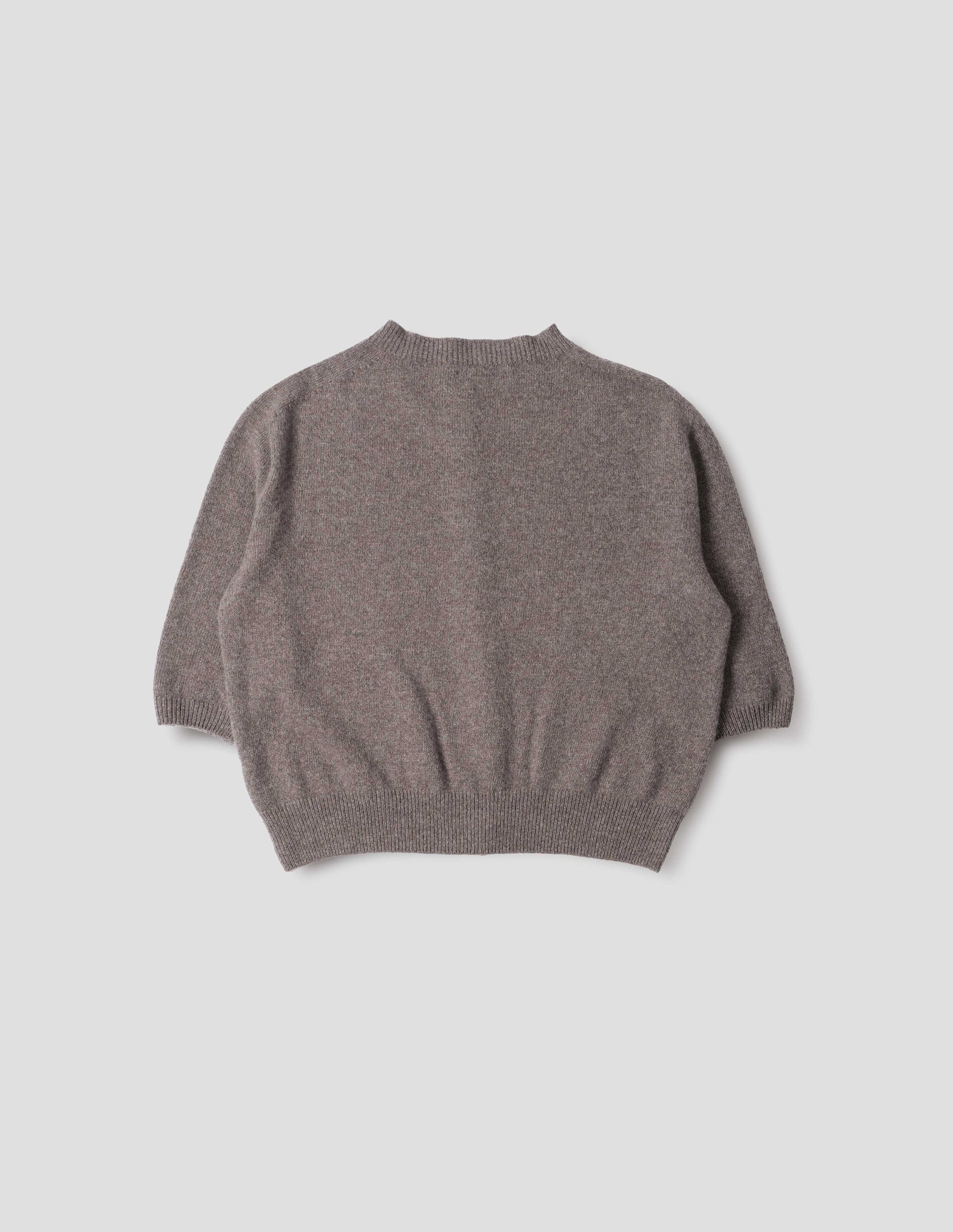 Greyish beige cashmere cotton cardigan, with elbow length saddle sleeve. Back flat lay view.