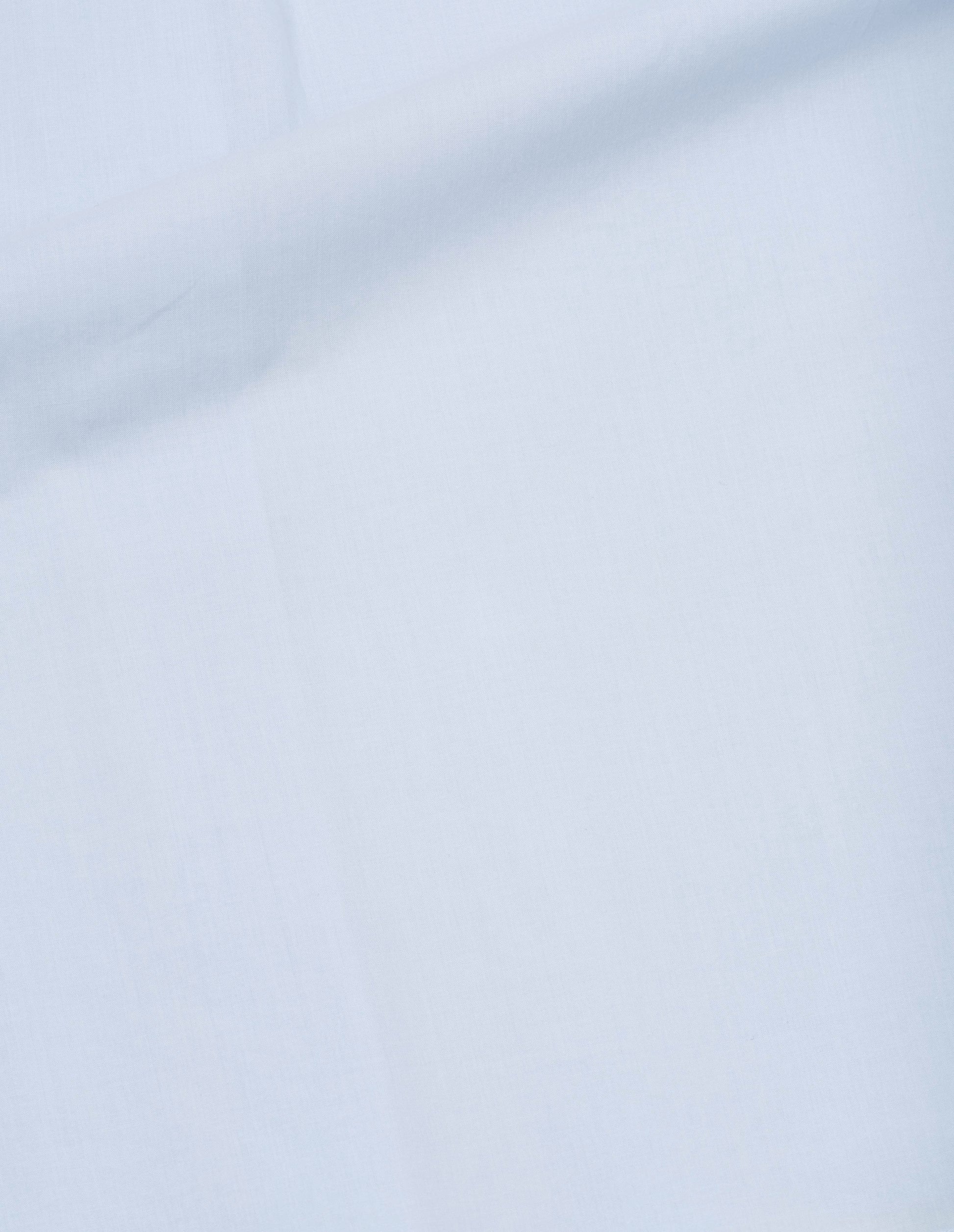 Light blue washed cotton shirt fabric swatch.