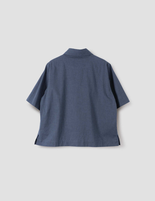 Light blue cotton short sleeve shirt, with side split hem. Back flat lay view.