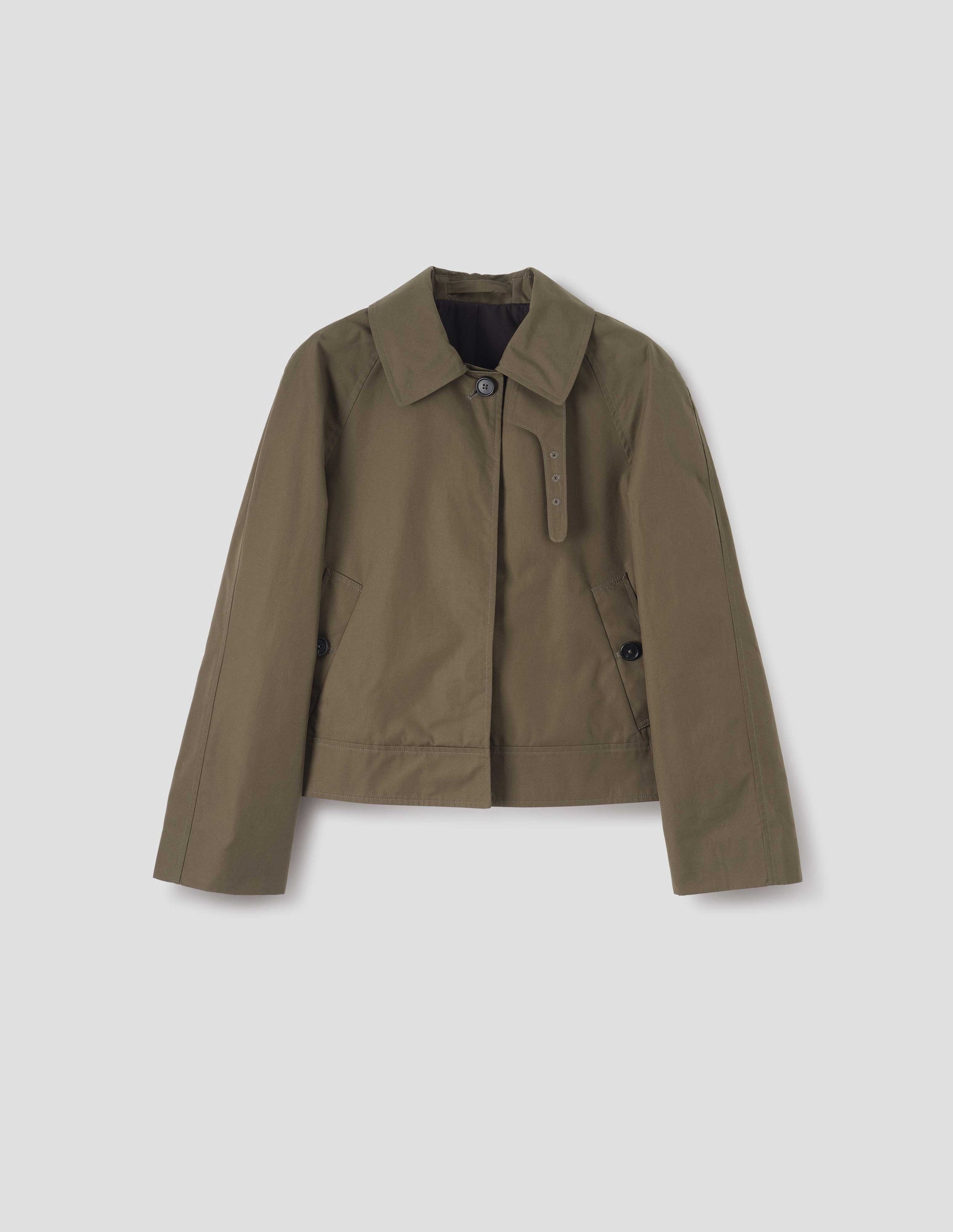Greenish brown ventile cotton poplin long sleeve short trench, with horn button closure, slant side pockets, with removable storm tab and hanger loop on collar, front flat lay view. 