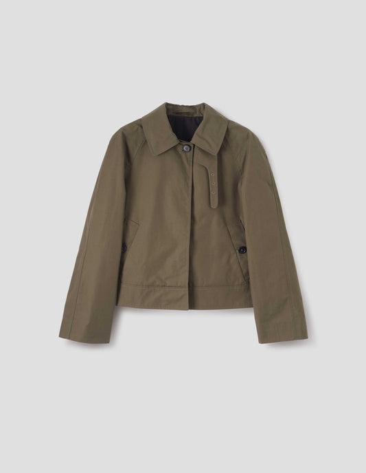 Greenish brown ventile cotton poplin long sleeve short trench, with horn button closure, slant side pockets, with removable storm tab and hanger loop on collar, front flat lay view. 