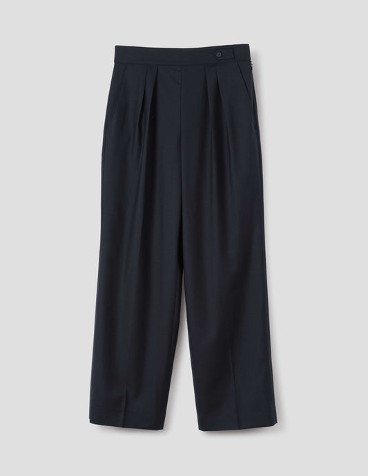 Dark navy summer wool trousers with double pleats, concealed side zip, pull through double tab side fastening and slant side pockets, front flat lay view.