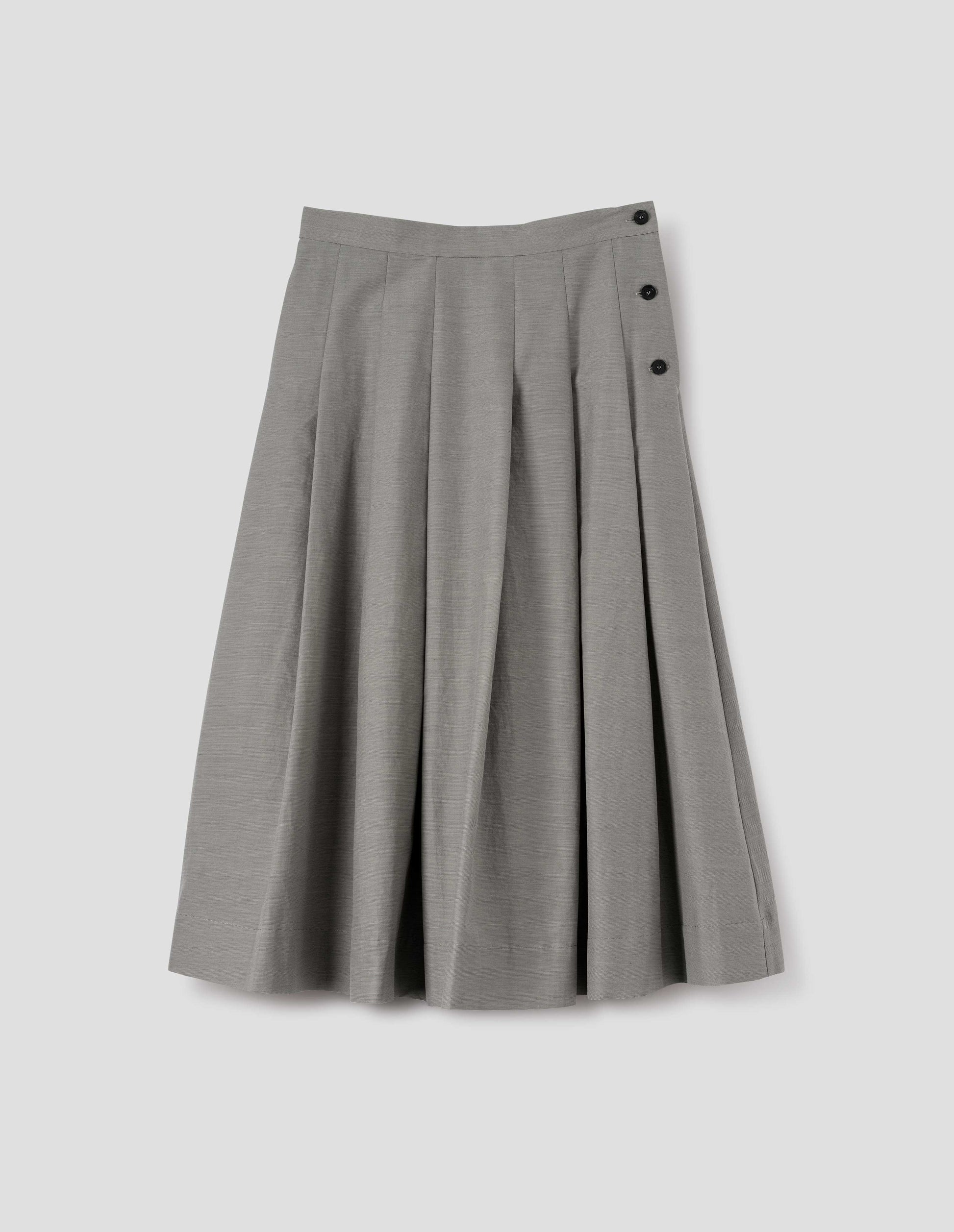 Black and cream stripe relaxed cut below knee skirt, minimal waistband and side button fastening, stitched down pleats, and concealed side seam pockets. Front flat lay view.