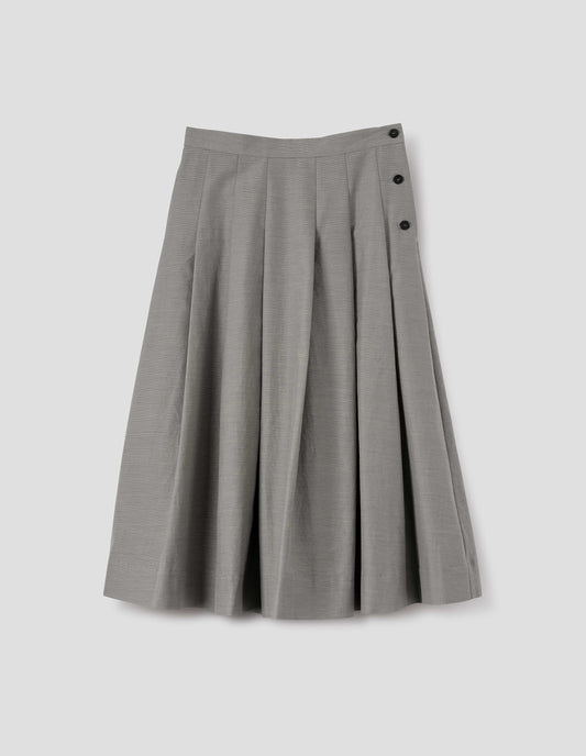Black and cream stripe relaxed cut below knee skirt, minimal waistband and side button fastening, stitched down pleats, and concealed side seam pockets. Front flat lay view.
