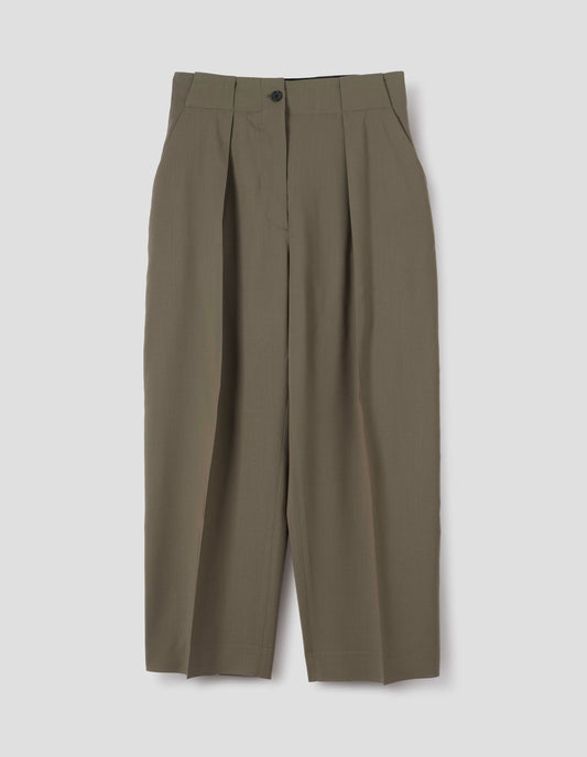 Brown wool trousers, single pleats and grown-on waistband with large belt loops and horn button. Front flat lay view.