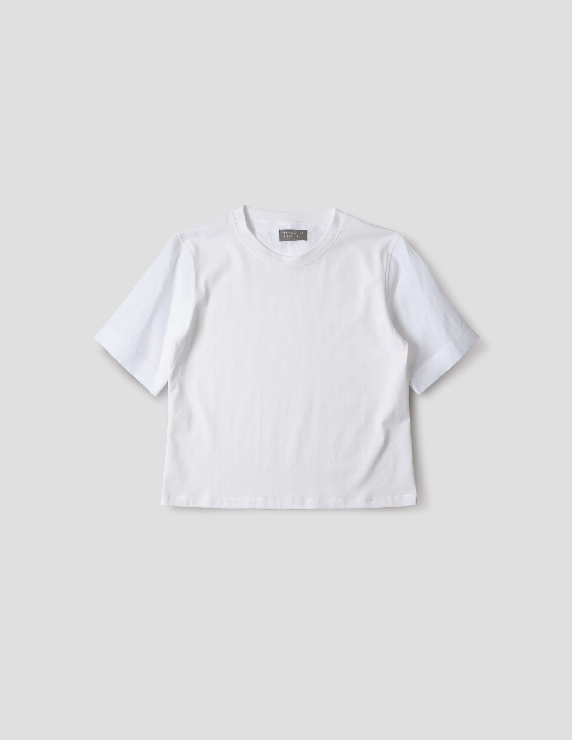 White regular cut t-shirt with contrast Irish shirting linen sleeve, front flat lay view.