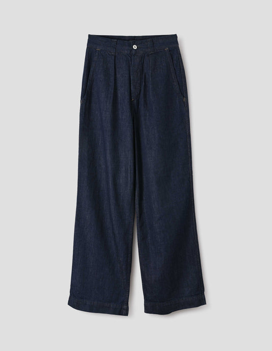Dark blue pleated denim twill trousers with wide straight leg, high waist, metal button fly and belt loops, and curved slant pockets. Front flat lay view.