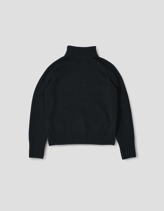 Dark navy blue cashmere roll neck jumper with contrast ribbing on neck, cuffs and hem. Back flat lay view.